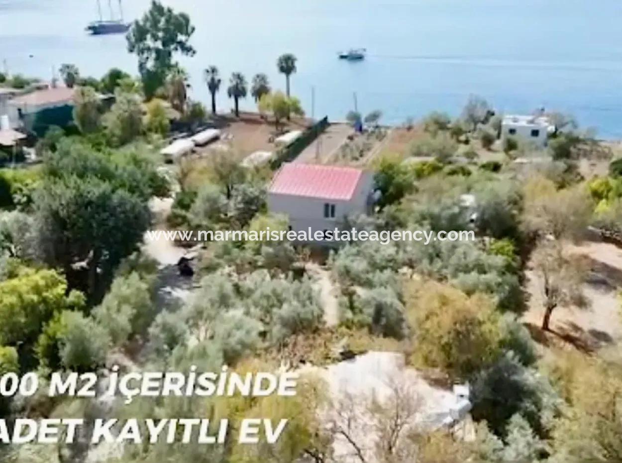 Marmaris Söğüt Mahallesi Denize Sıfır 2000M2 Arsa Satılık Müstakil Ev.önüne Tekne Bağlamaya Uygun.